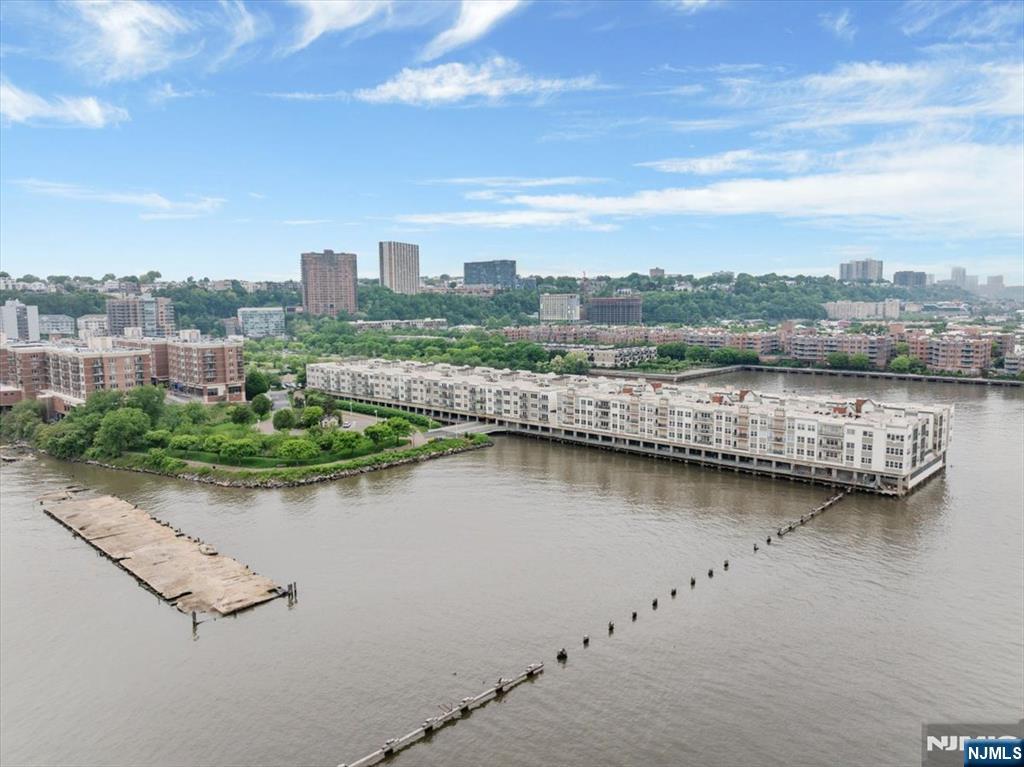 214 The Promenade, Unit 214 Edgewater, NJ 07020 - Photo 14 of 36 an aerial view of residential building with outdoor space and lake view