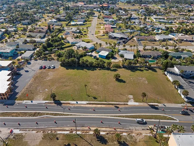 an aerial view of a house with a lake view
