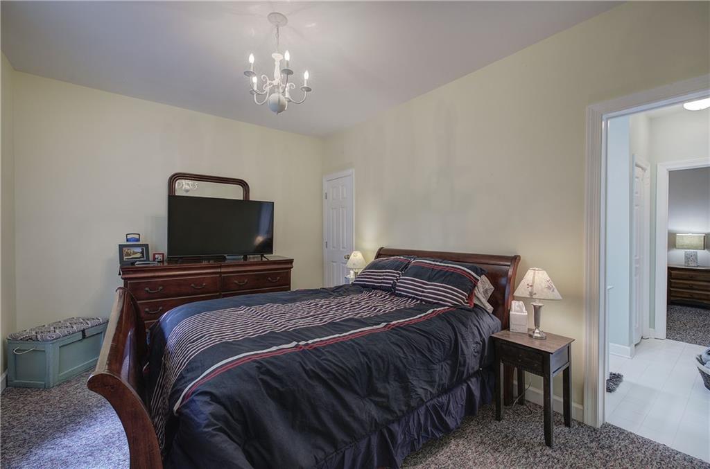 181 Fox Den Circle Jasper, GA 30143 - Photo 63 of 111 a bedroom with a bed and a tv