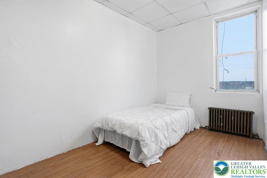 1171 Mechanic Street Bethlehem, PA 18015 - Photo 12 of 25 a bedroom with a bed and a window