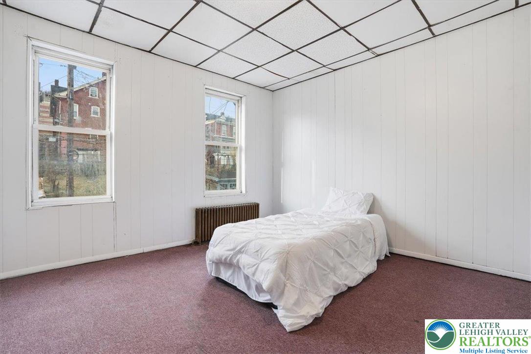 1171 Mechanic Street Bethlehem, PA 18015 - Photo 10 of 25 a bedroom with a bed and a window