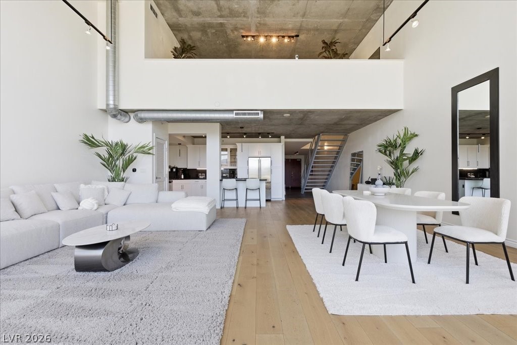 360 East Desert Inn Road, Unit 604 Las Vegas, NV 89109 - Photo 21 of 28 Exposed concrete ceilings complement the spacious open-concept design, perfect for modern urban living.