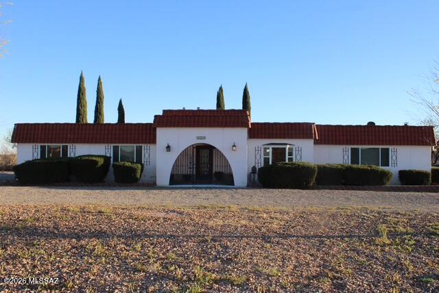 1201 East Old Stewart Road Willcox, AZ 85643 - Photo 1 of 49 a front view of a house with a yard