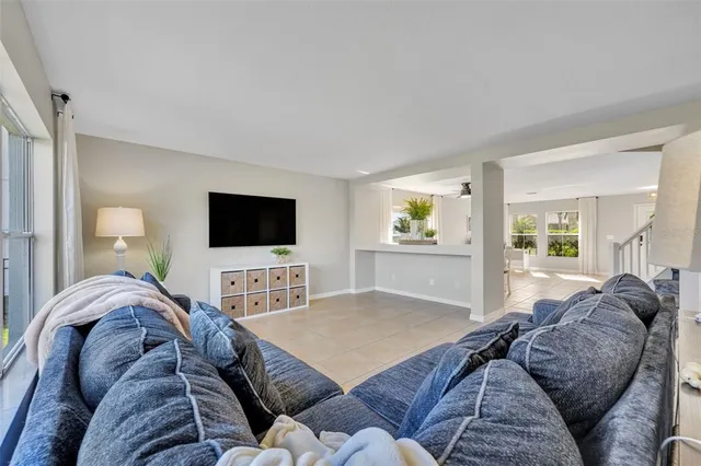 a living room with a couch and a flat screen tv