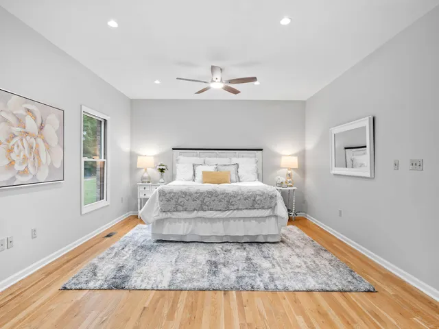 a bathroom with double vanity sinks and a mirror