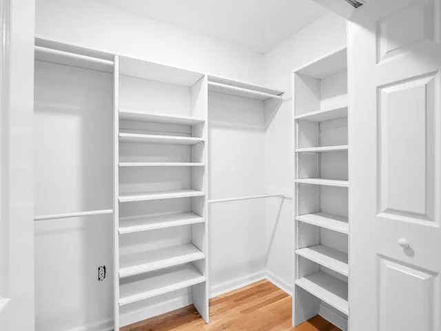 an aerial view of a house with outdoor space and swimming pool