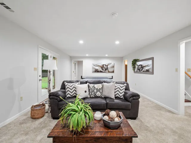 an aerial view of a houses with a lake view