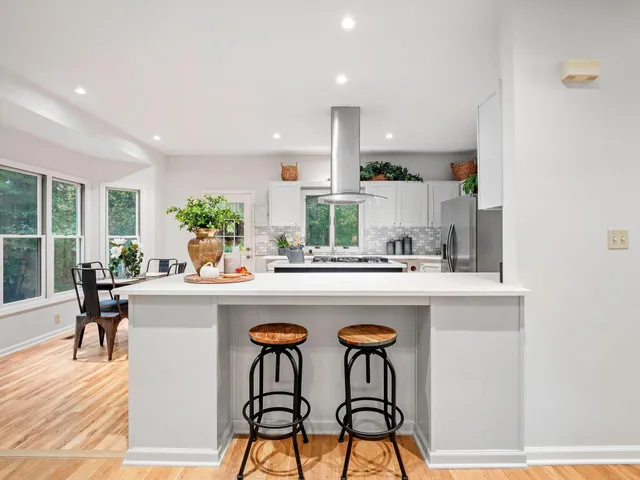 a view of a dining room with furniture window and outside view