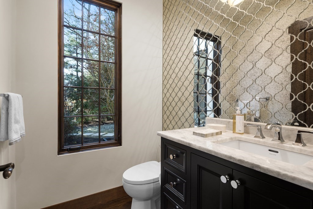 17 Bridle Pth Path Weston, MA 02493 - Photo 11 of 42 a bathroom with a granite countertop sink toilet and mirror