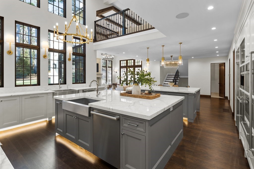 17 Bridle Pth Path Weston, MA 02493 - Photo 12 of 42 a kitchen with kitchen island granite countertop a sink a counter top space and stainless steel appliances