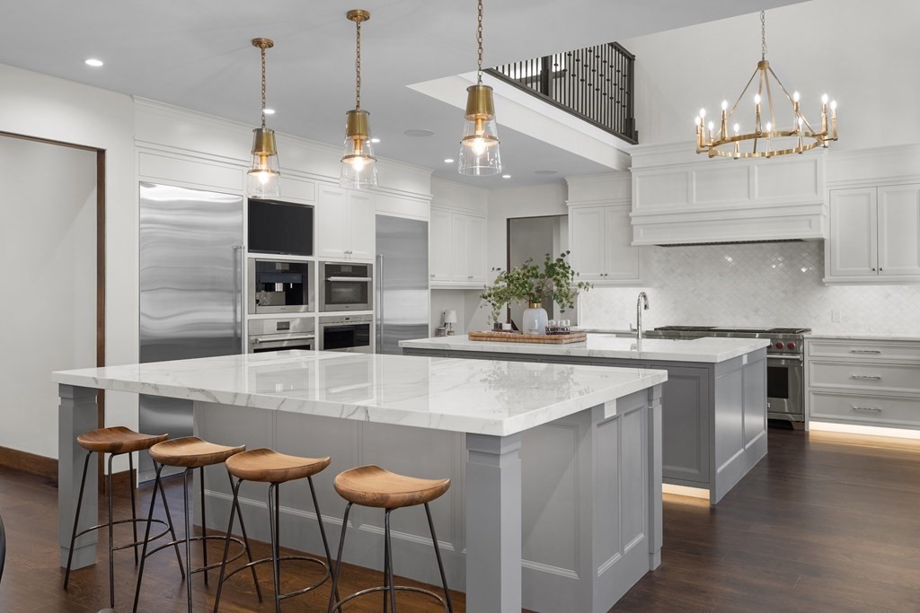 17 Bridle Pth Path Weston, MA 02493 - Photo 13 of 42 a kitchen with kitchen island a large counter top space appliances and cabinets