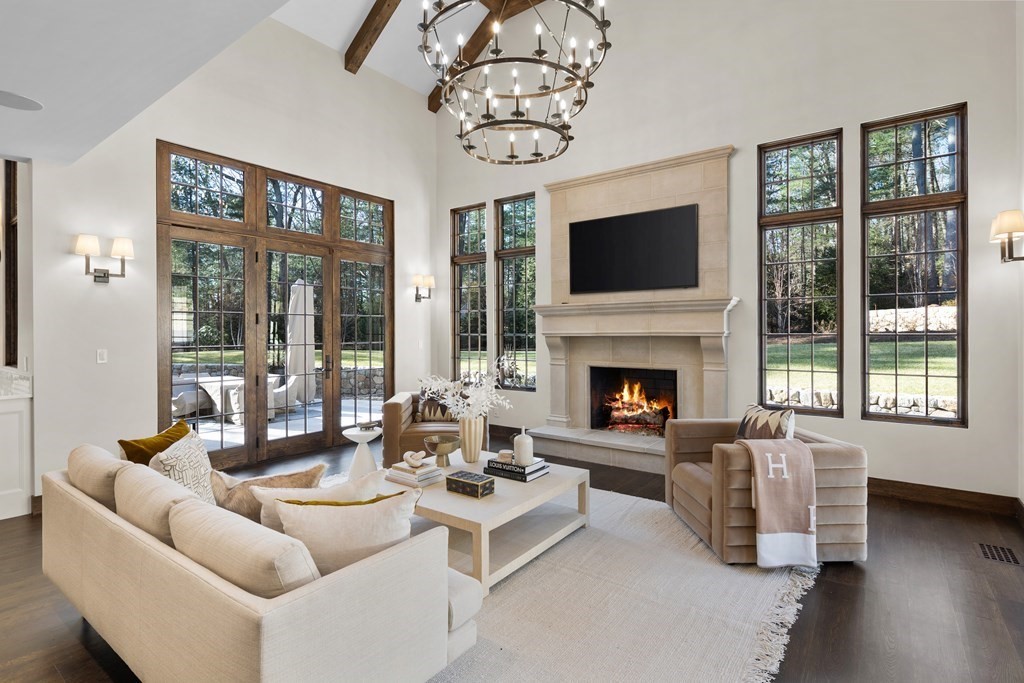 17 Bridle Pth Path Weston, MA 02493 - Photo 17 of 42 a living room with furniture large window and flat screen tv
