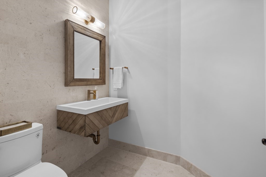 17 Bridle Pth Path Weston, MA 02493 - Photo 18 of 42 a bathroom with a sink a toilet and mirror