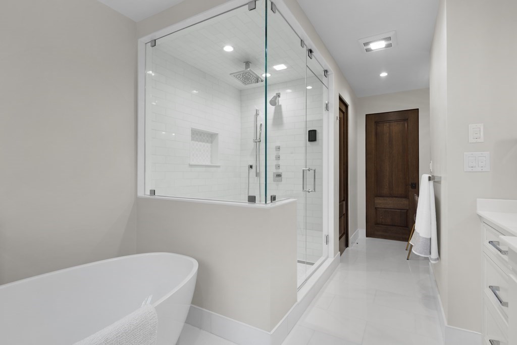 17 Bridle Pth Path Weston, MA 02493 - Photo 23 of 42 a bathroom with a bathtub and a shower