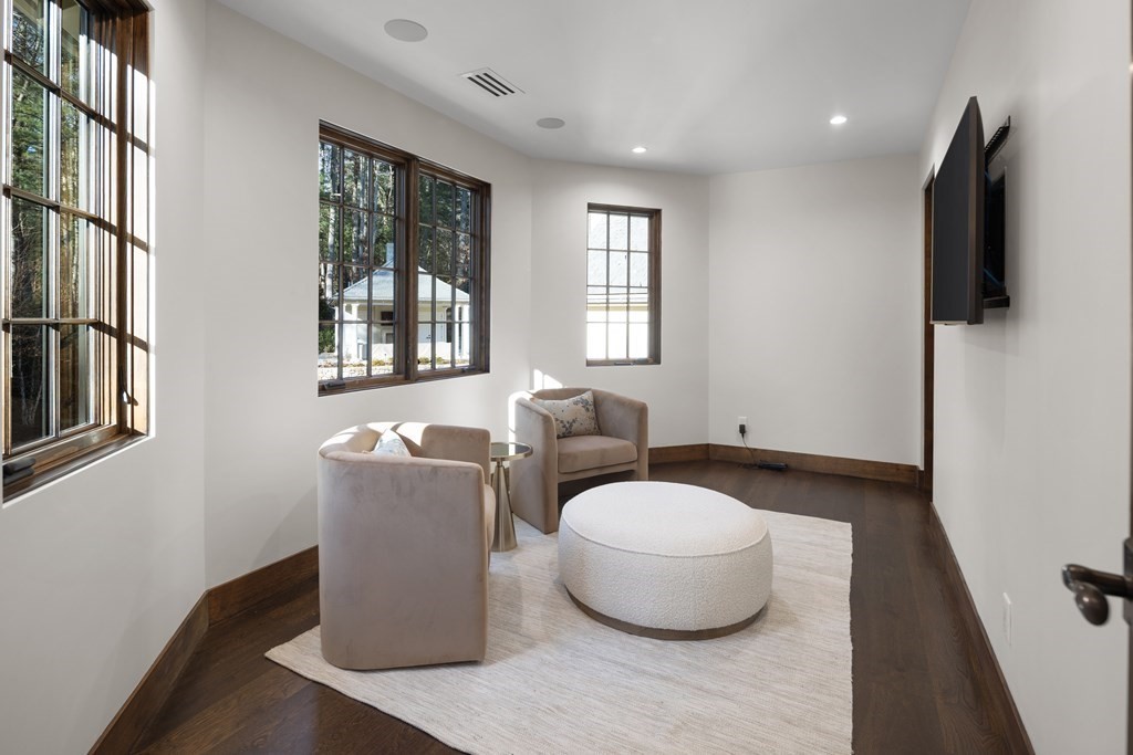 17 Bridle Pth Path Weston, MA 02493 - Photo 25 of 42 a living room with furniture and a flat screen tv