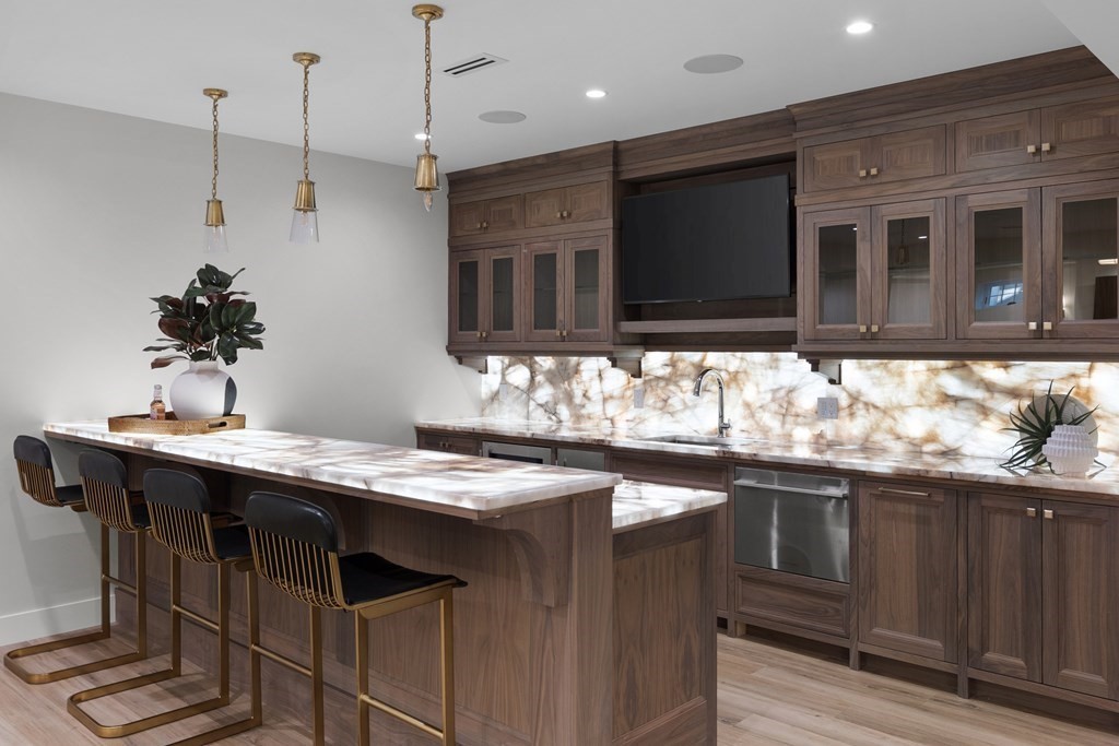 17 Bridle Pth Path Weston, MA 02493 - Photo 27 of 42 a kitchen with stainless steel appliances granite countertop a sink and cabinets