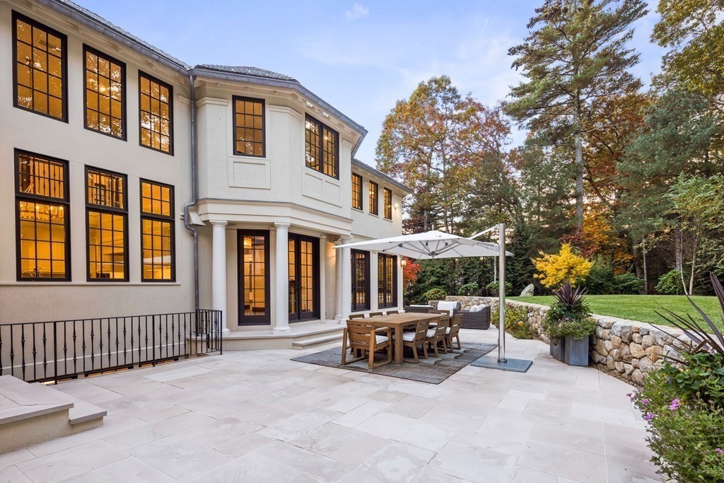 17 Bridle Pth Path Weston, MA 02493 - Photo 40 of 42 a couple of cars parked in front of a house
