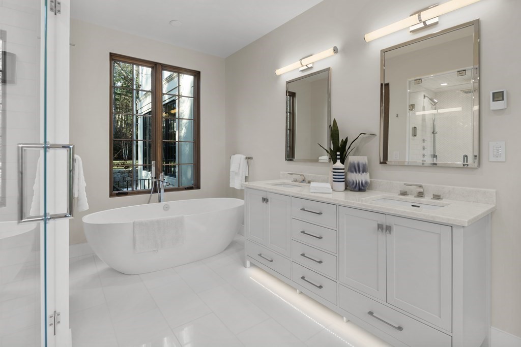 17 Bridle Pth Path Weston, MA 02493 - Photo 10 of 42 a bathroom with a tub sink and mirror