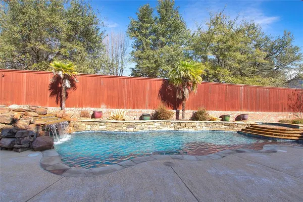a view of a swimming pool with a patio