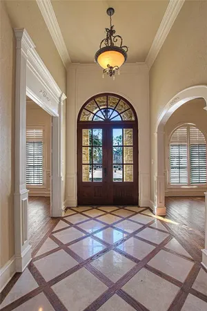 a view of an entryway with wooden floor