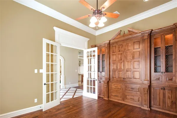 a view of a livingroom with wooden floor and a fireplace