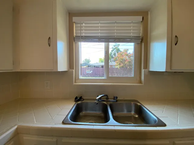 a bathroom with a sink and window