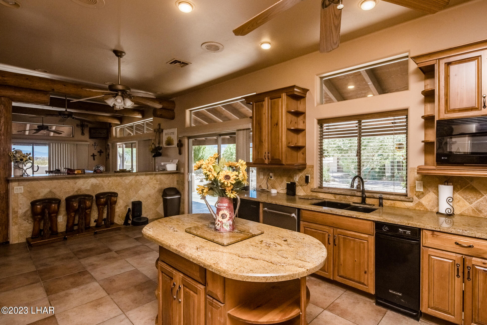 4203 West Wilshire Road Yucca, AZ 86438 - Photo 24 of 113 Kitchen window over looks POOL