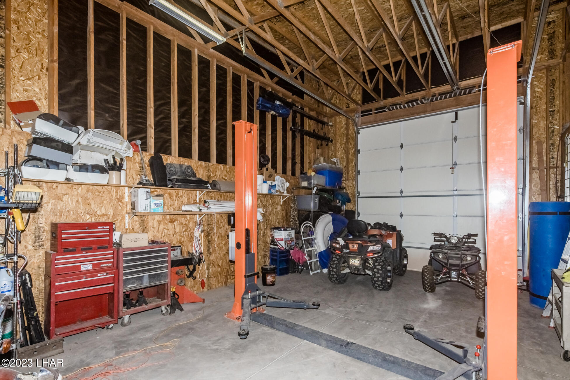 4203 West Wilshire Road Yucca, AZ 86438 - Photo 48 of 113 Car lift with 12ft Garage Door