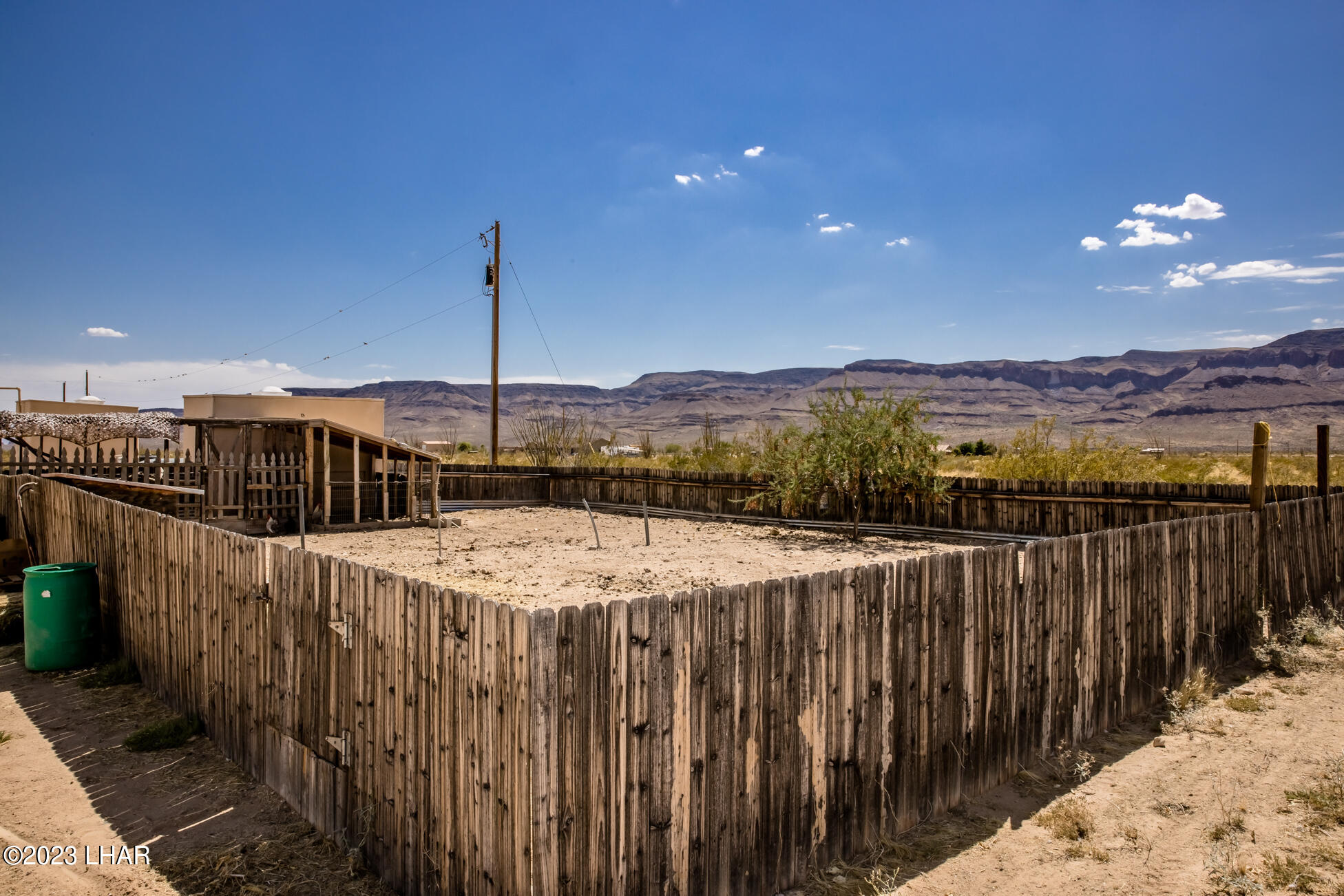 4203 West Wilshire Road Yucca, AZ 86438 - Photo 78 of 113 Chicken coop and gated area for other livestock