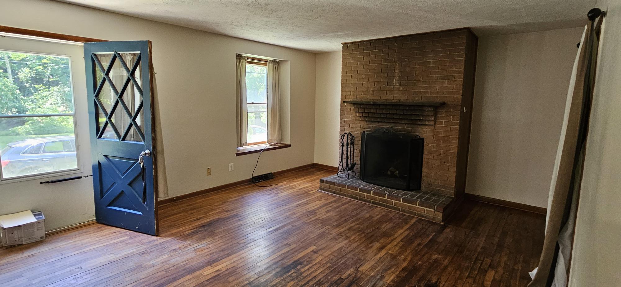 206 Octoraro Road Conowingo, MD 21918 - Photo 4 of 29 Open Living Room w/Hdwd Floor & Wood Burn FP 29x13