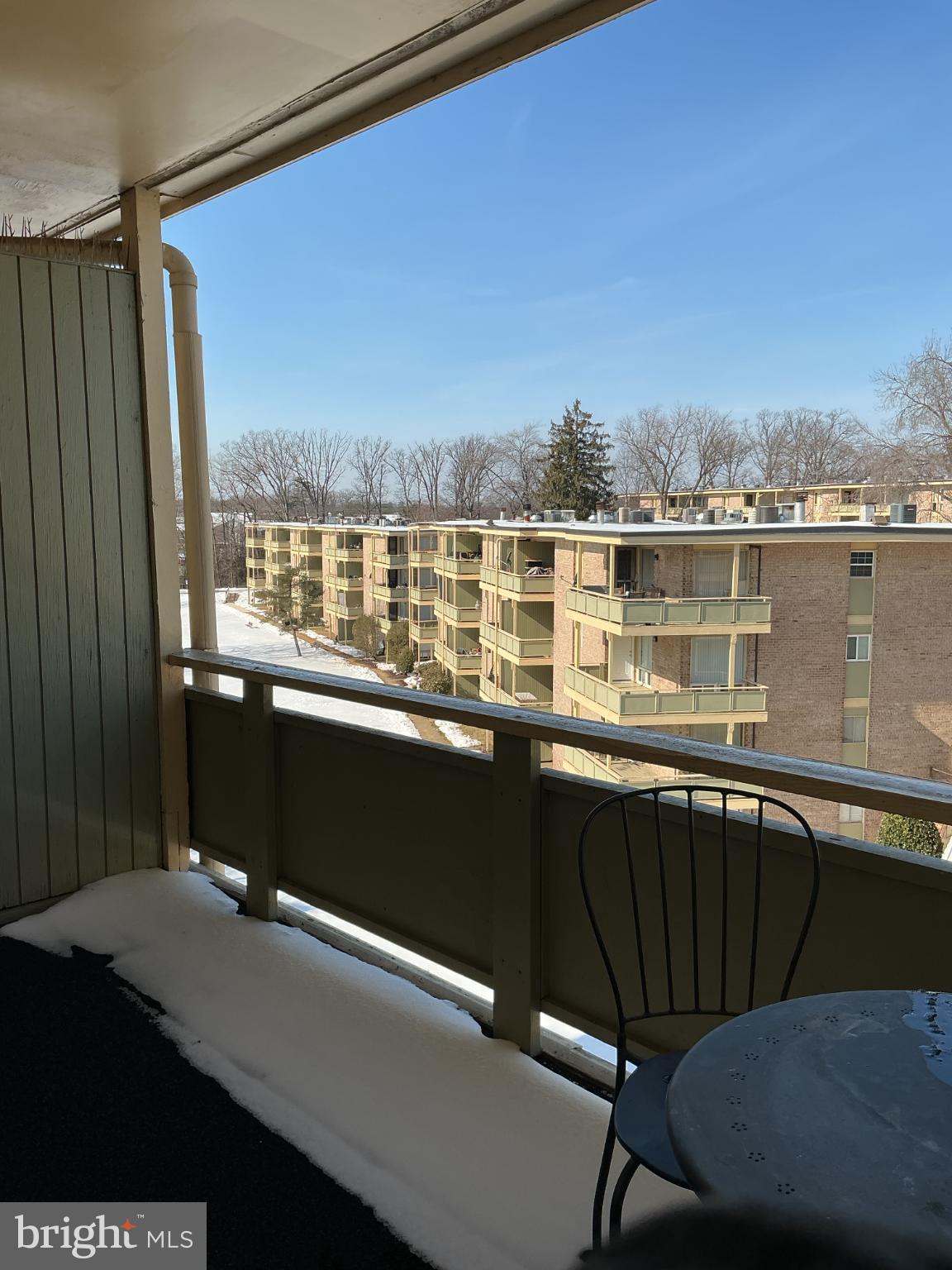 Sunny balcony view over winter's embrace.