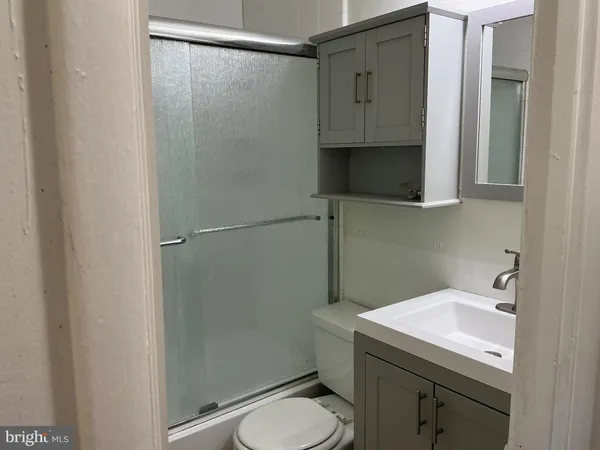 a bathroom with a sink and washing machine