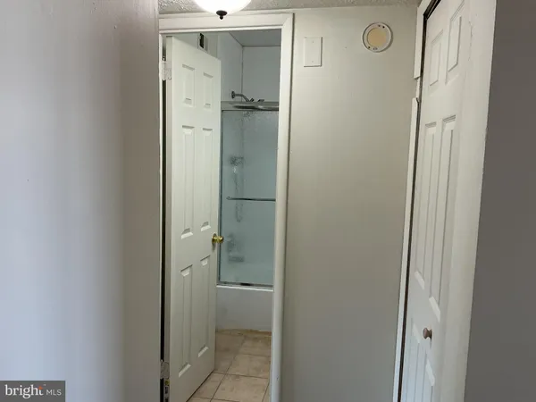 an empty room with a empty space and windows