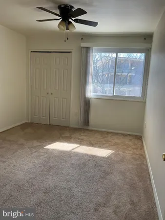 a view of an empty room and entryway