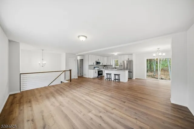a room with a bed and a table with wooden floor