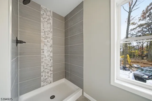 a bathroom with a shower and a sink