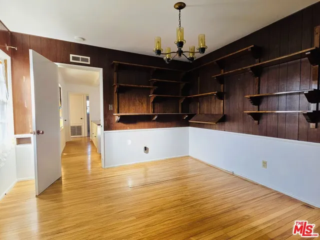 a view of a kitchen with a sink and cabinets