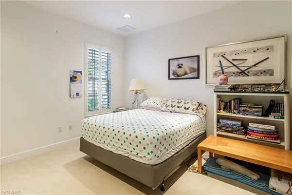 a bedroom with a bed and closet