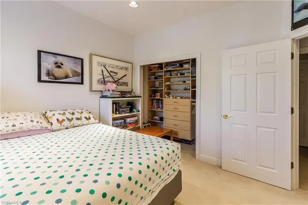 a room with a bed and a closet
