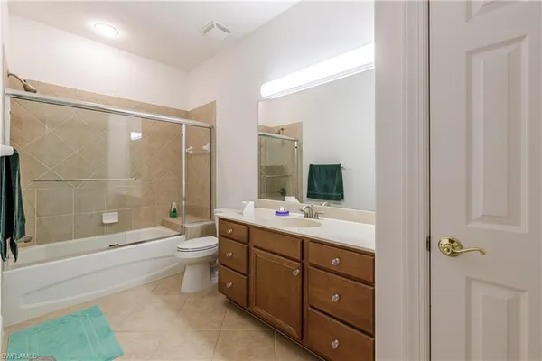 a bathroom with a mirror and a shower