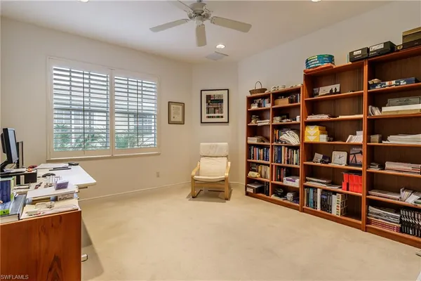 a bedroom with bed and a window