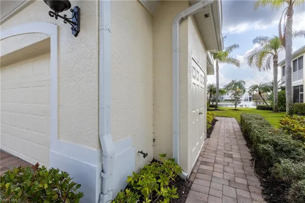 a view of a pathway both side of a house