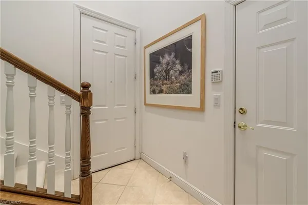 a view of a livingroom with furniture and stairs