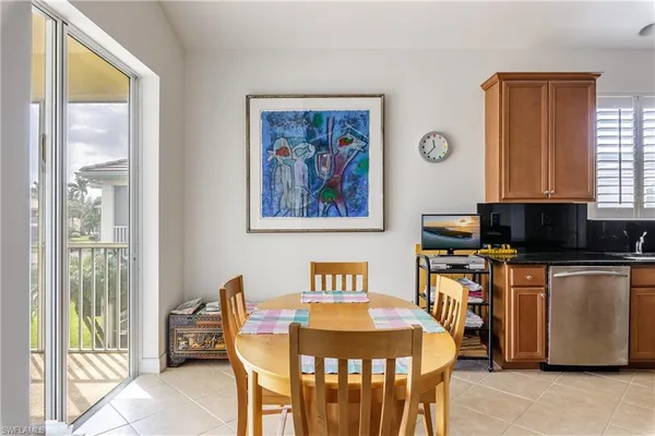 a living room with furniture and large windows