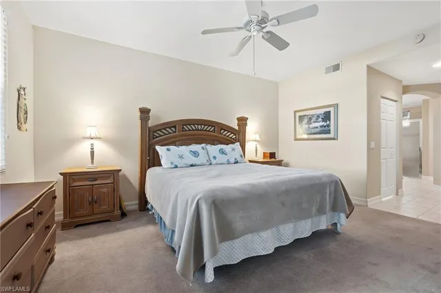 a bedroom with a bed and dresser