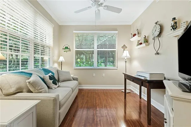 a view of a house with a backyard from a balcony