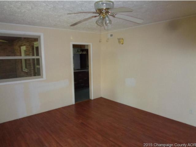 785 Iuka Road Iuka, IL 62849 - Photo 4 of 17 an empty room with wooden floor closet and windows