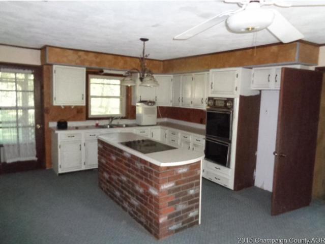 785 Iuka Road Iuka, IL 62849 - Photo 6 of 17 a kitchen with stainless steel appliances granite countertop a sink stove and refrigerator
