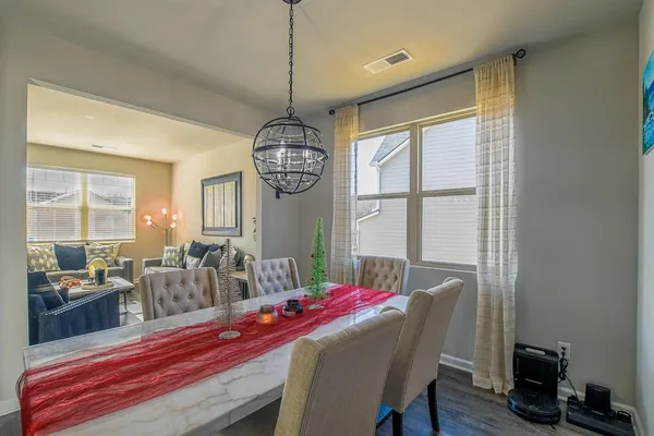 a view of a dining room with furniture window and outside view