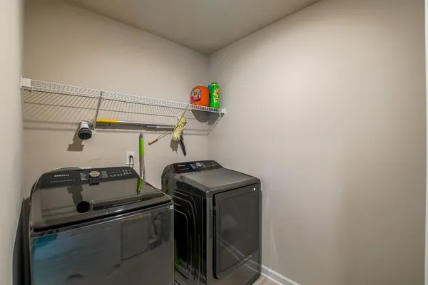 a utility room with dryer and washer